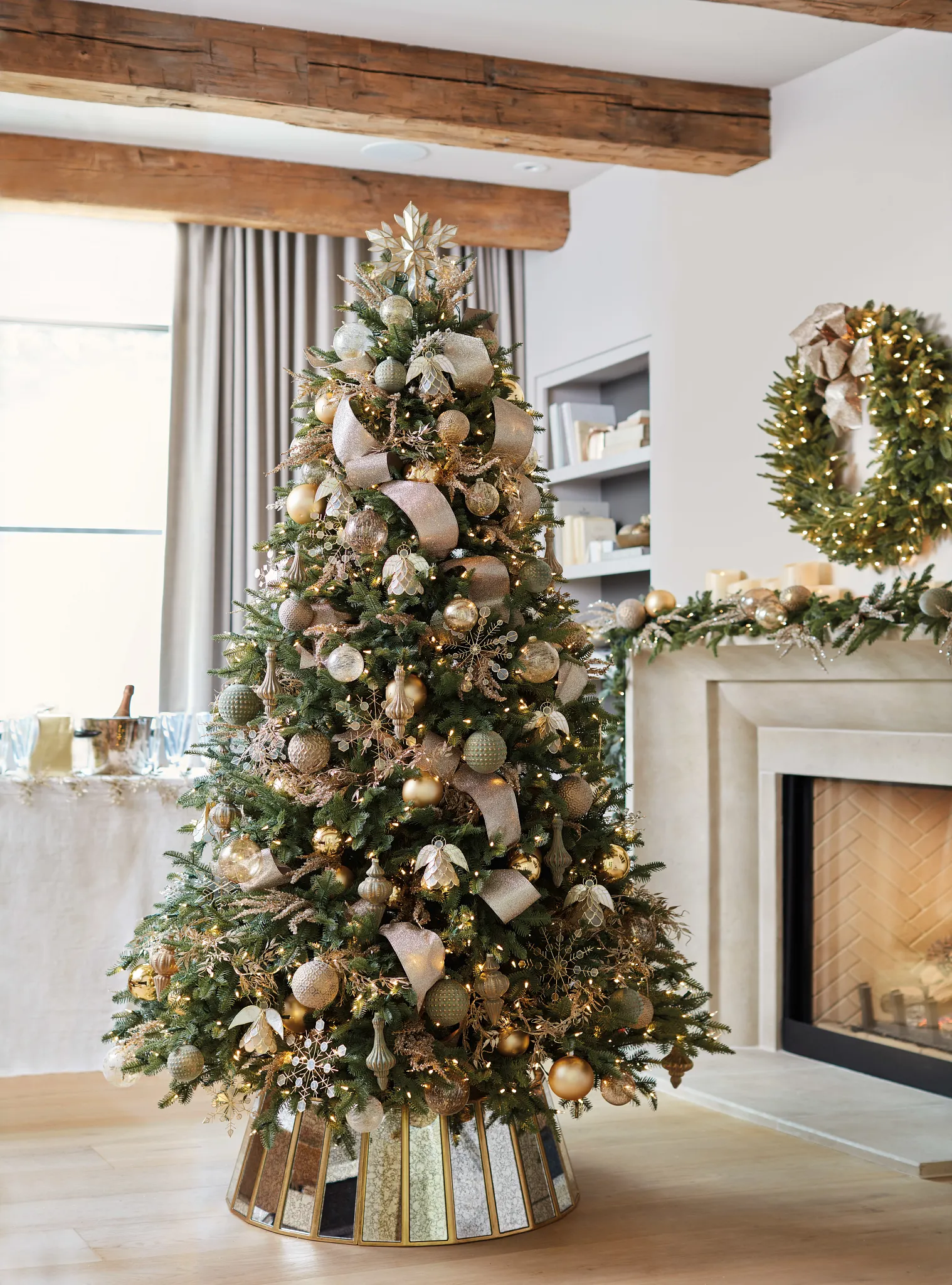 Glamorous Living Room with Ornate Tree and Fireplace Garland Glamorous Living Room with Ornate Tree and Fireplace Garland — christmas decor trends 2026