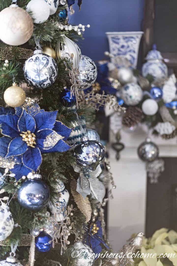 Elegant Blue and White Christmas Tree with Poinsettia Ornaments — Elegant Christmas Decor