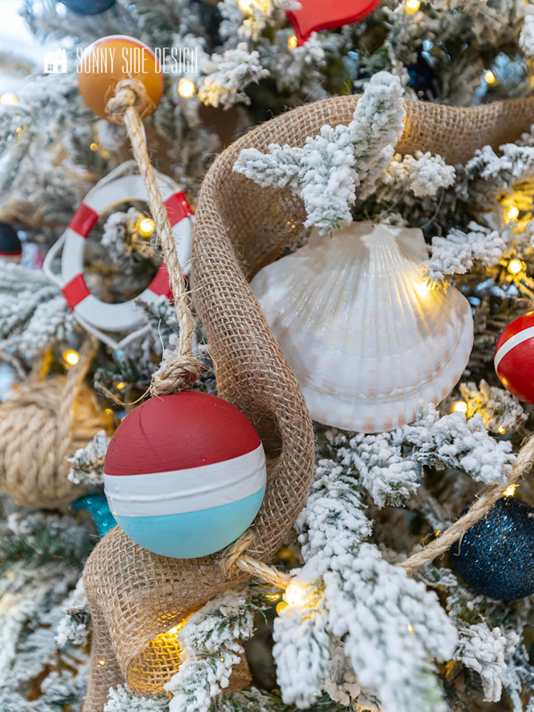 Flocked Christmas Tree with Nautical Ornaments Flocked Christmas Tree with Nautical Ornaments — Coastal Christmas Decor