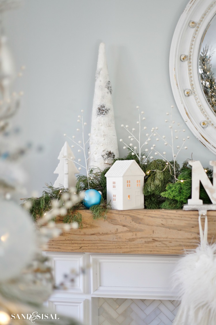 Coastal Mantel Decor with White Ceramic Houses and Frosted Trees Coastal Mantel Decor with White Ceramic Houses and Frosted Trees — White Christmas Decor