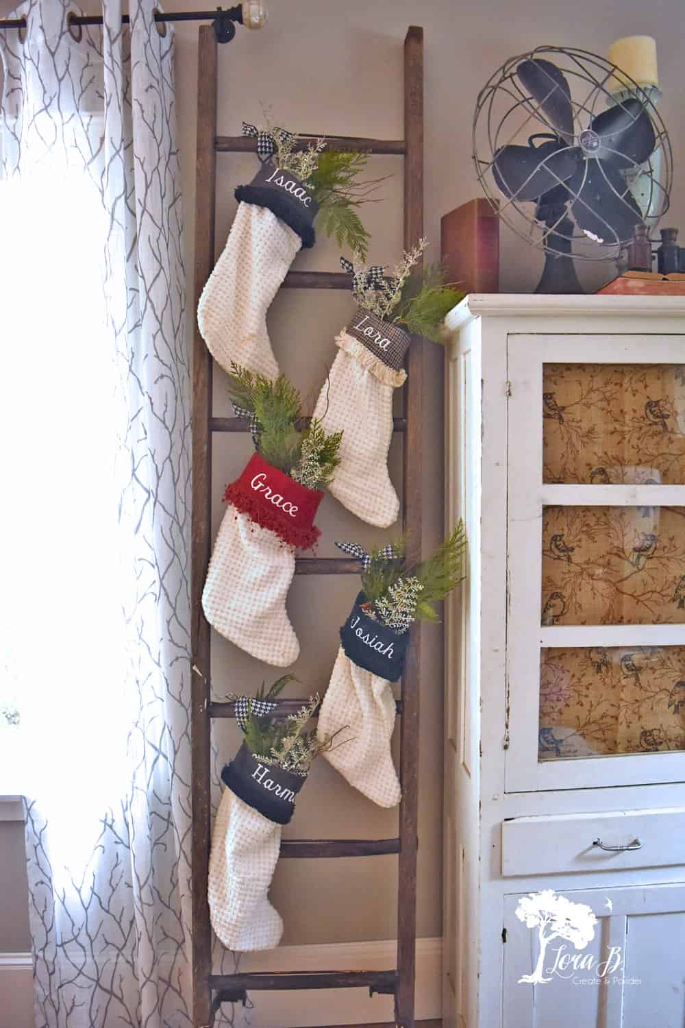 Greenery-Adorned Stockings on a Ladder — Christmas Stockings Display