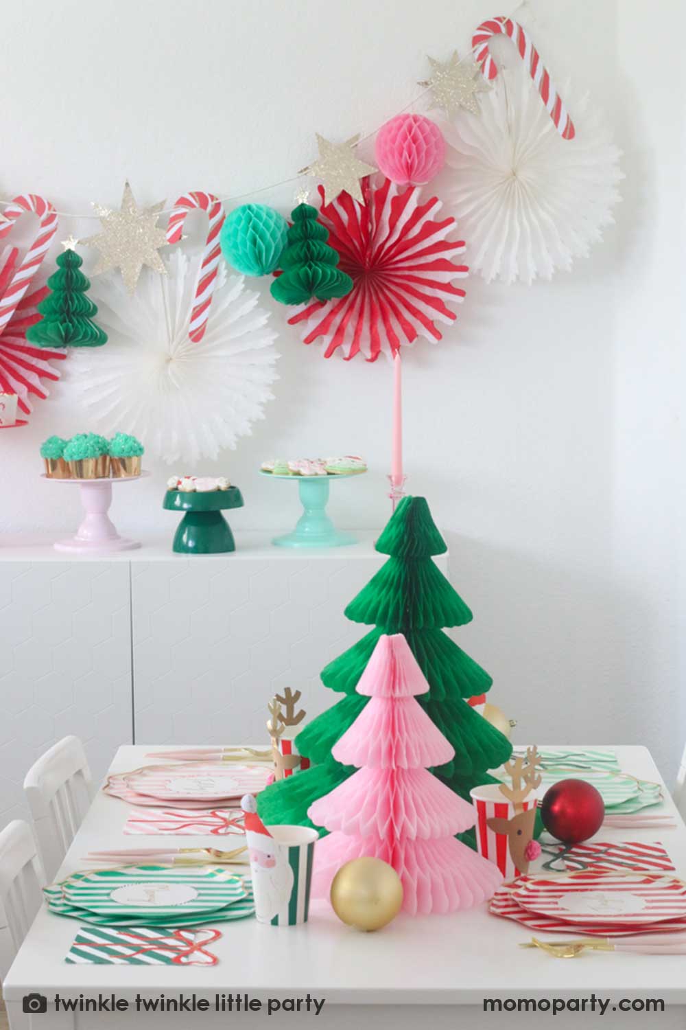 Whimsical Dining Table with Paper Honeycomb Trees and Candy Cane Garland — Christmas Party Decor