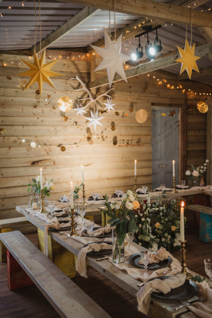 Outdoor Reception with Star Lanterns and Greenery — Christmas Wedding Decor