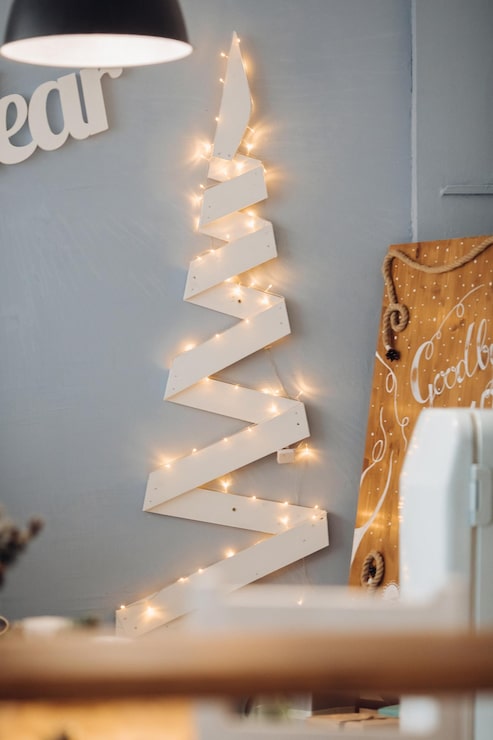 Corner Vignette Modern Living Room with Geometric Fairy Light Christmas Tree Corner Vignette Modern Living Room with Geometric Fairy Light Christmas Tree — Christmas Fairy Lights Wall