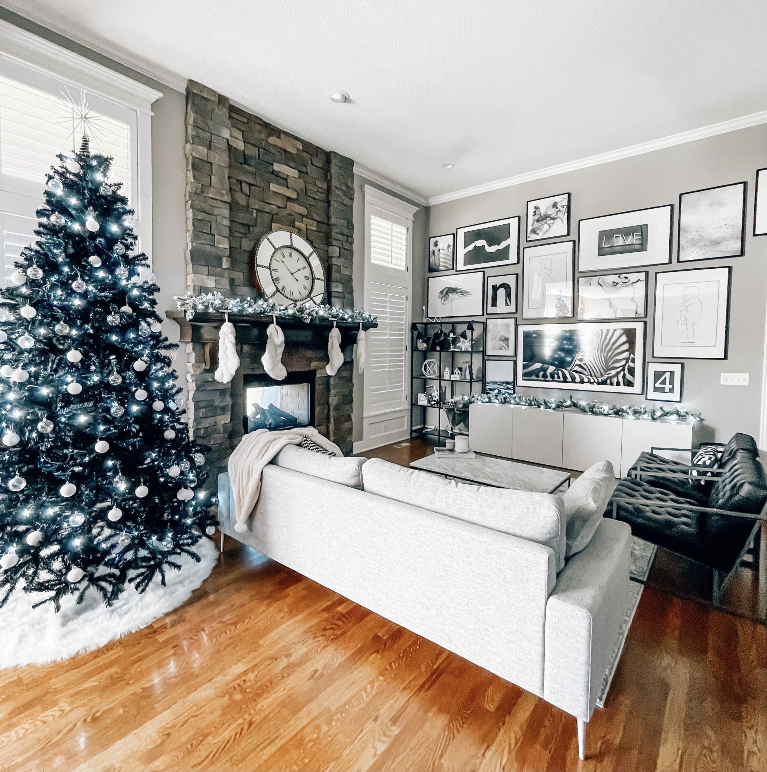 Modern Living Room with Stone Fireplace and Large Gallery Wall — Modern Christmas Decor