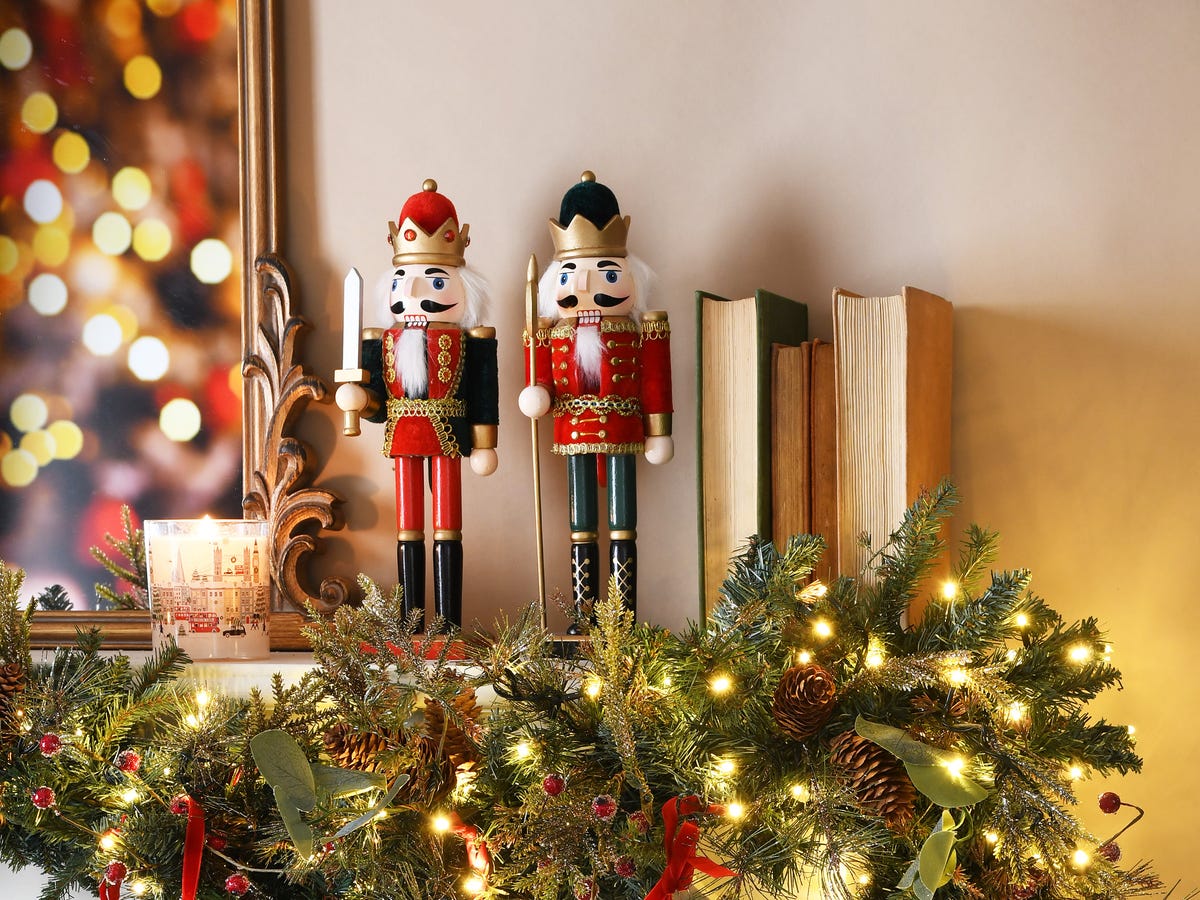 Classic Nutcrackers on a Mantel with Fairy Lit Garland Classic Nutcrackers on a Mantel with Fairy Lit Garland — Nutcracker Christmas Decor