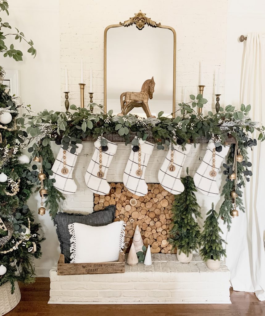 Elegant Farmhouse Fireplace with Gold Rocking Horse and Plaid Stockings Elegant Farmhouse Fireplace with Gold Rocking Horse and Plaid Stockings — Christmas Fireplace Decor