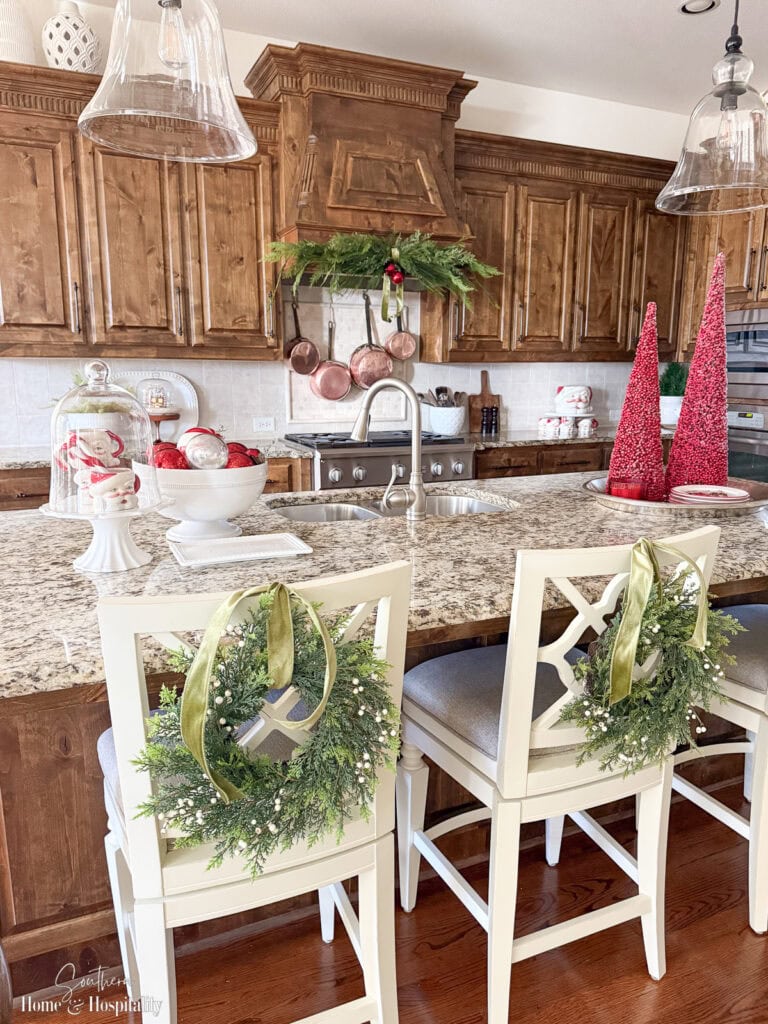 Traditional Kitchen Island Adorned with Festive Greenery and Red Trees — Christmas Kitchen Decor