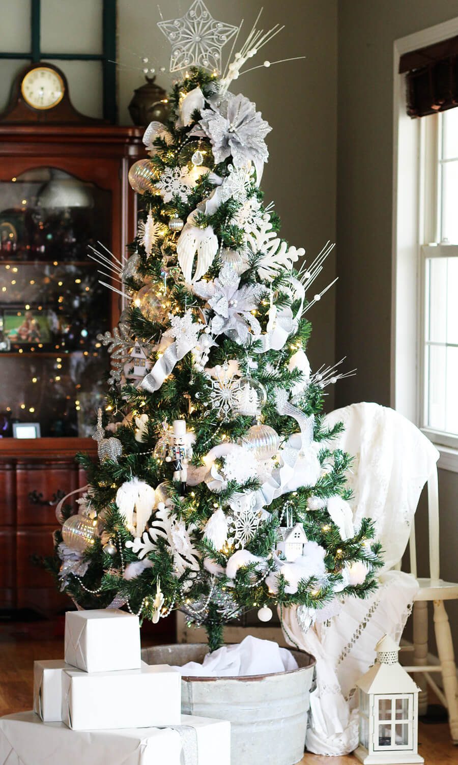 Elegant Entryway with Flocked Trees, Mirror, and Decorative Village Elegant Entryway with Flocked Trees, Mirror, and Decorative Village — White Christmas Decor