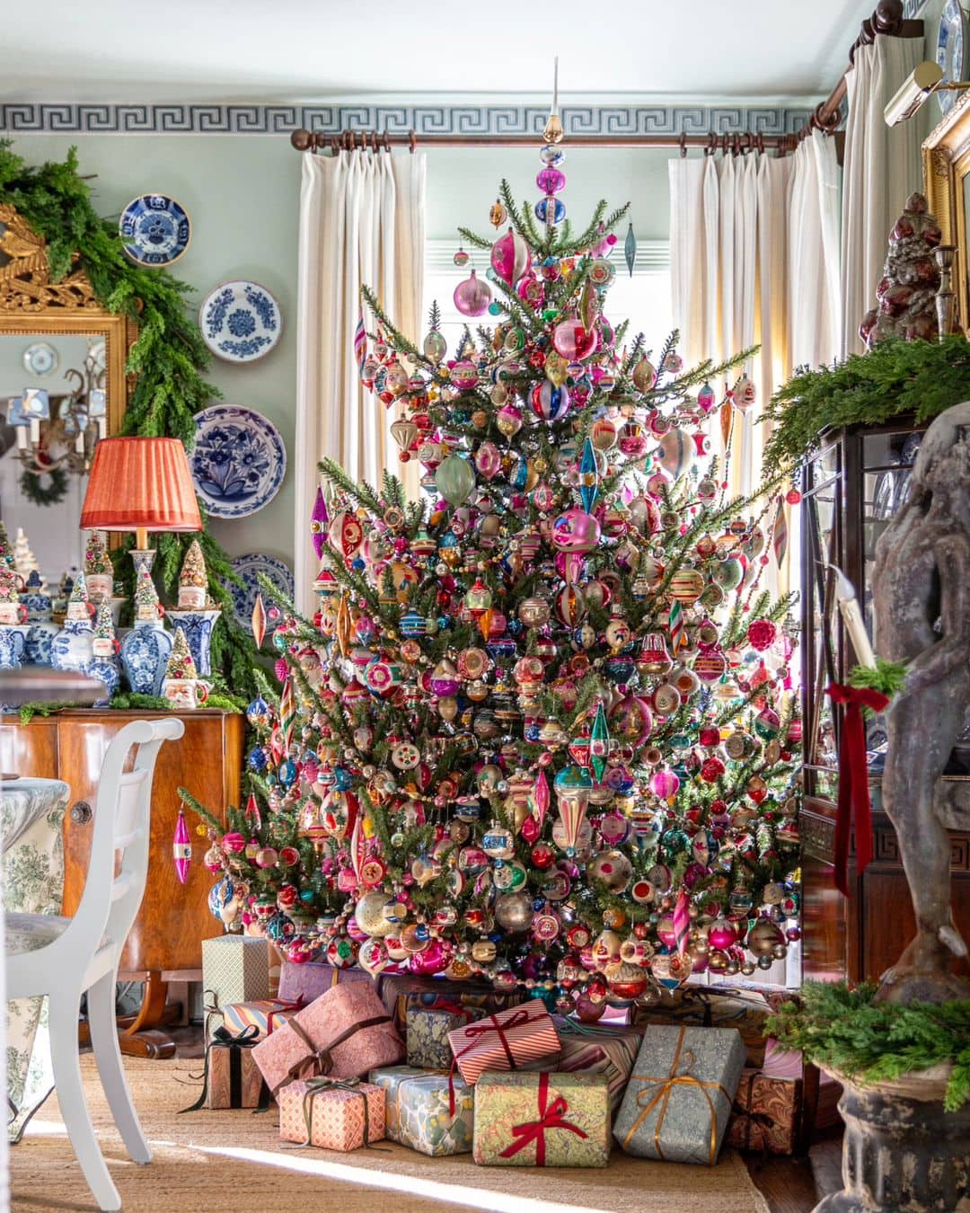 Eclectic Christmas Tree with Colorful Ornaments and Antique Furniture — Christmas Tree Decorating