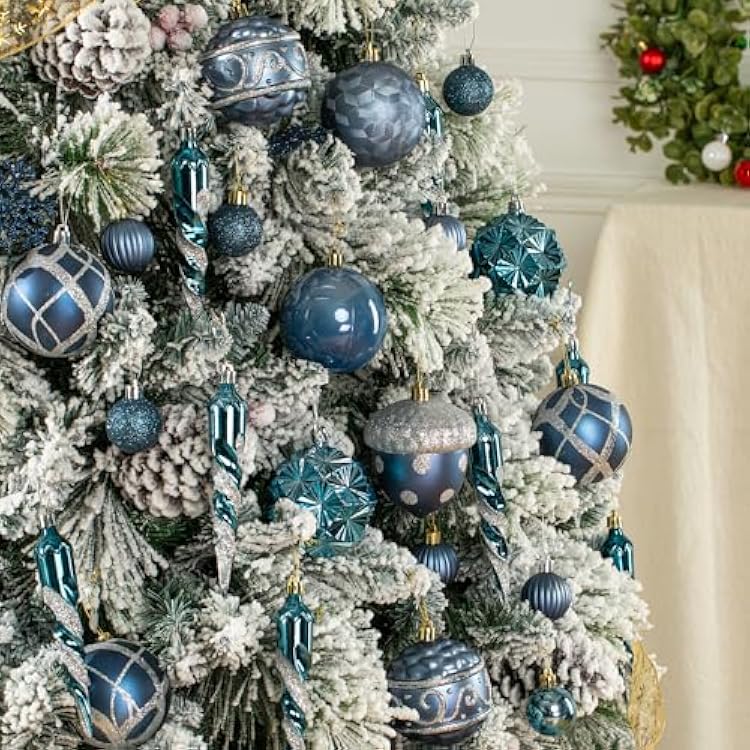 Flocked Tree with Dense Navy Blue and Teal Ornaments Flocked Tree with Dense Navy Blue and Teal Ornaments — Blue Christmas Decor