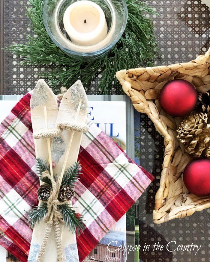 Farmhouse Coffee Table with Plaid Napkin and Skis Farmhouse Coffee Table with Plaid Napkin and Skis — Christmas Coffee Table Decor