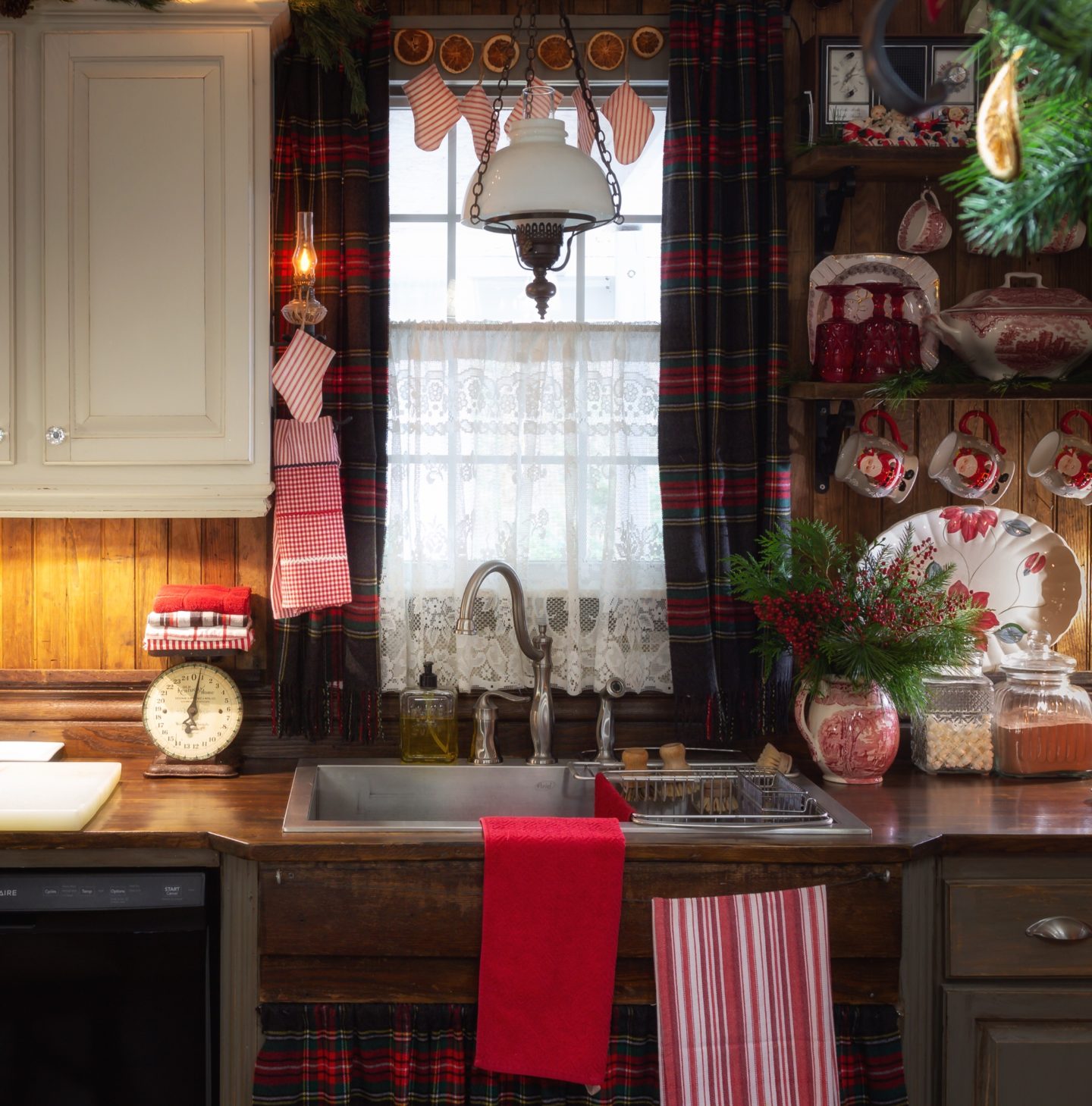 Farmhouse Kitchen Sink Area with Plaid Curtains and Hanging Stockings — Christmas Kitchen Decor