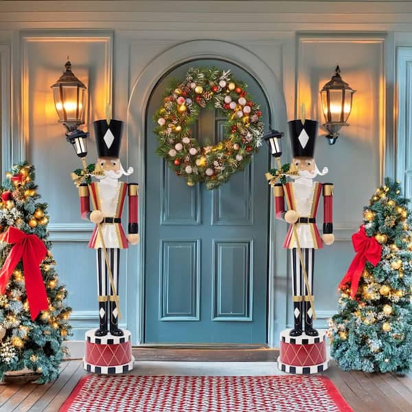 Large Traditional Nutcrackers Flanking a Blue Front Door Large Traditional Nutcrackers Flanking a Blue Front Door — Nutcracker Christmas Decor