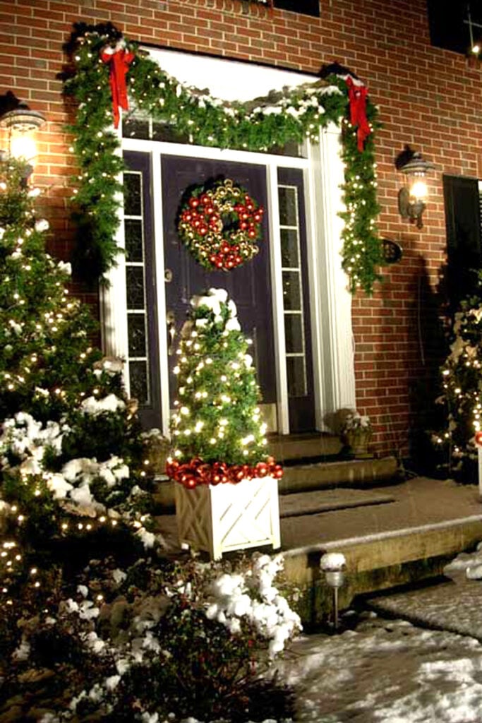 Dark Blue Door with Illuminated Potted Tree — Christmas House Exterior Decor