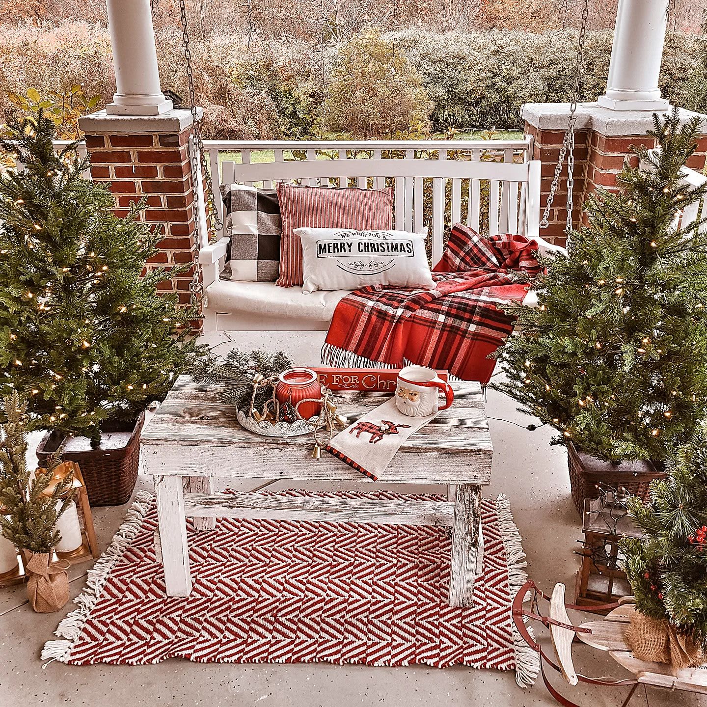 Farmhouse Porch with Swing Bench and Dual Christmas Trees — Christmas Balcony Decor