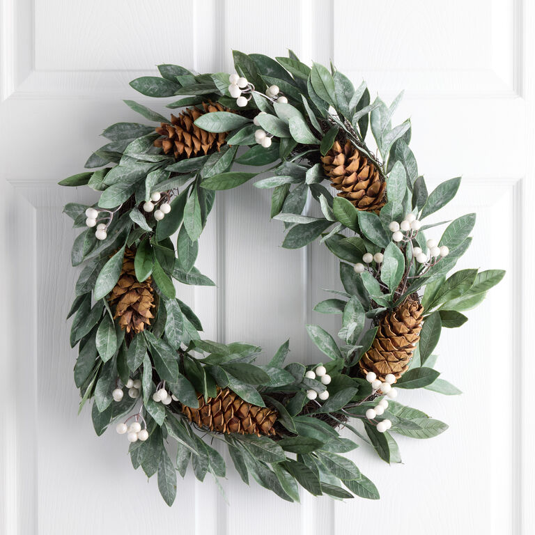 Natural Wreath with Pine Cones on a White Door Natural Wreath with Pine Cones on a White Door — Sage Green Christmas Decor