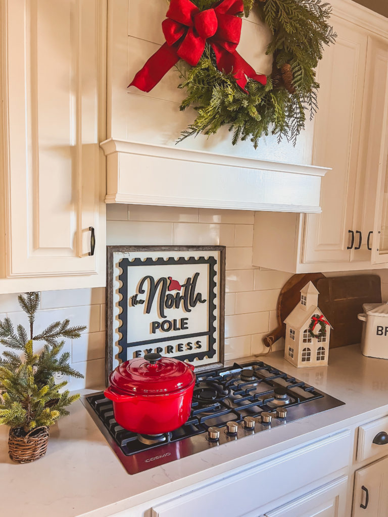 Christmas Stove Top Decor with Red Pot and 'North Pole Express' Sign — Christmas Kitchen Decor