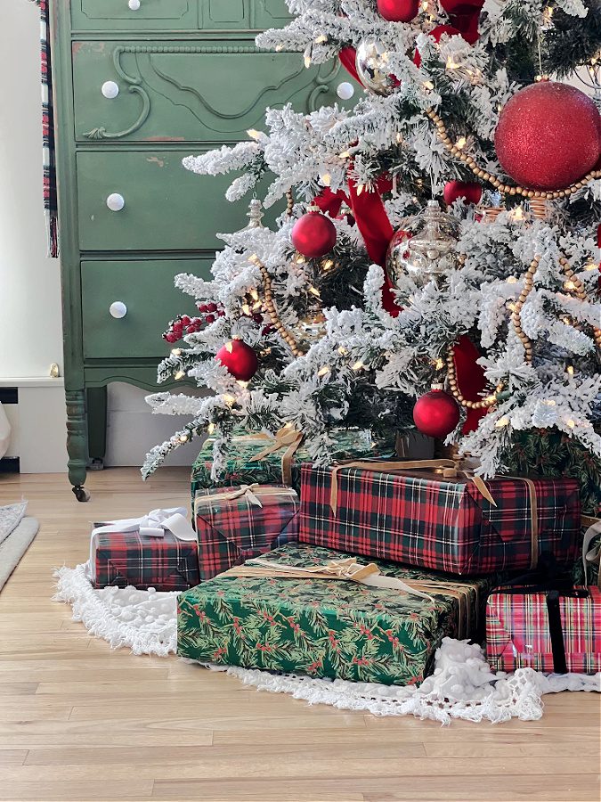 Flocked Christmas Tree Base with Red and Green Wrapped Gifts Flocked Christmas Tree Base with Red and Green Wrapped Gifts — Red and Green Christmas Decor