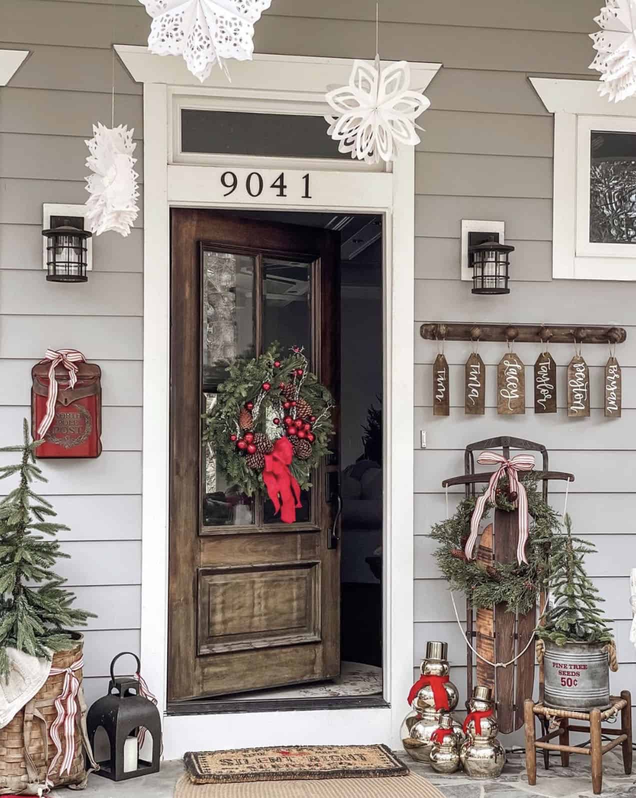 Festive Doorway with Christmas Trees, Lanterns, and a Sled — Farmhouse Christmas Porch