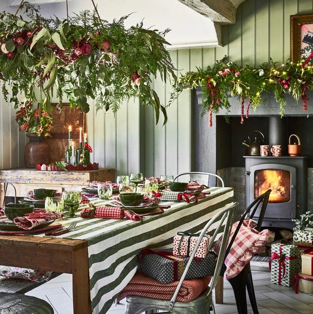 Rustic Farmhouse Dining with Lush Overhead Greenery Installation — Christmas Dining Room Decor