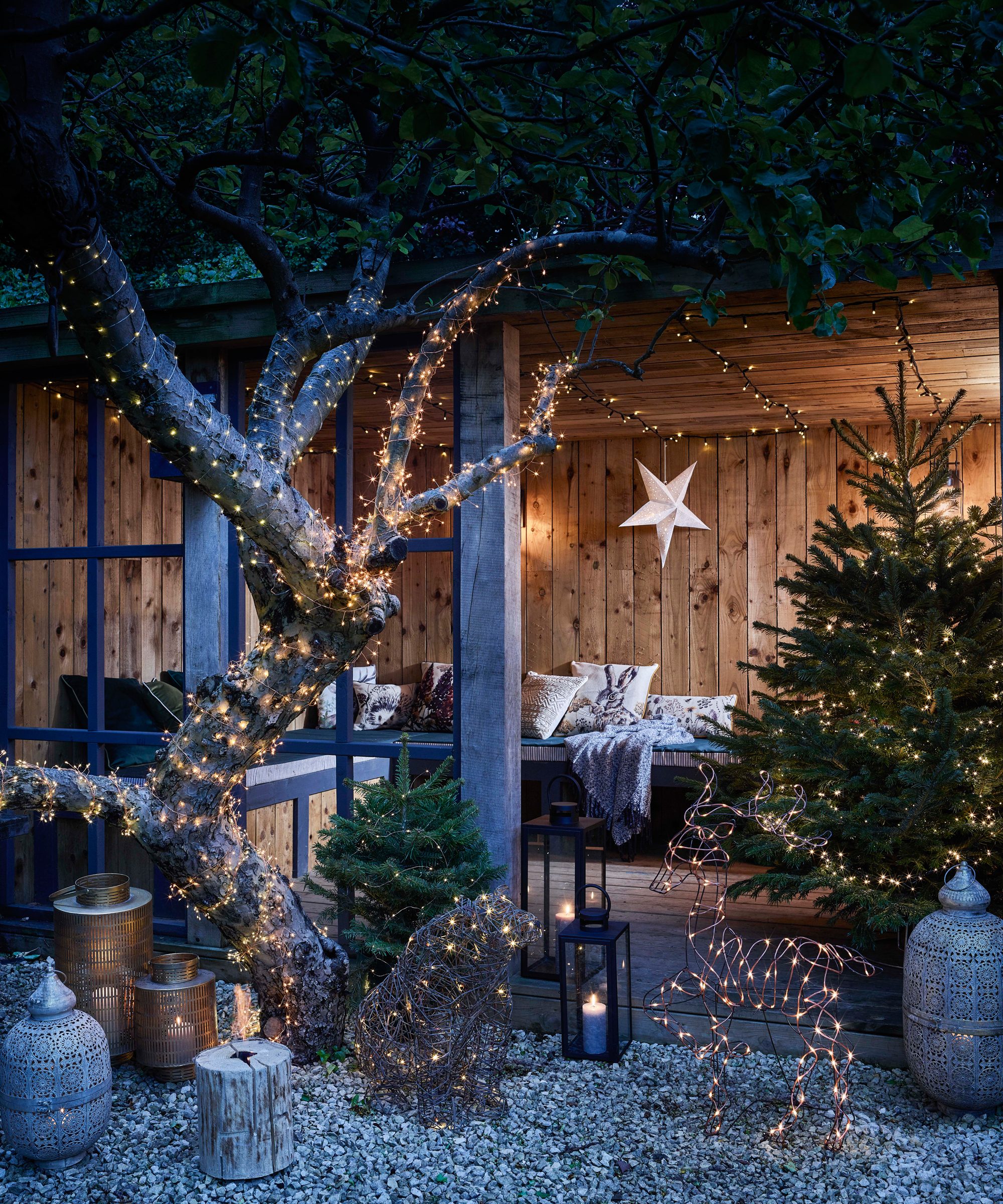 Whimsical Garden with Light-Wrapped Tree and Reindeer — Outdoor Christmas Lights