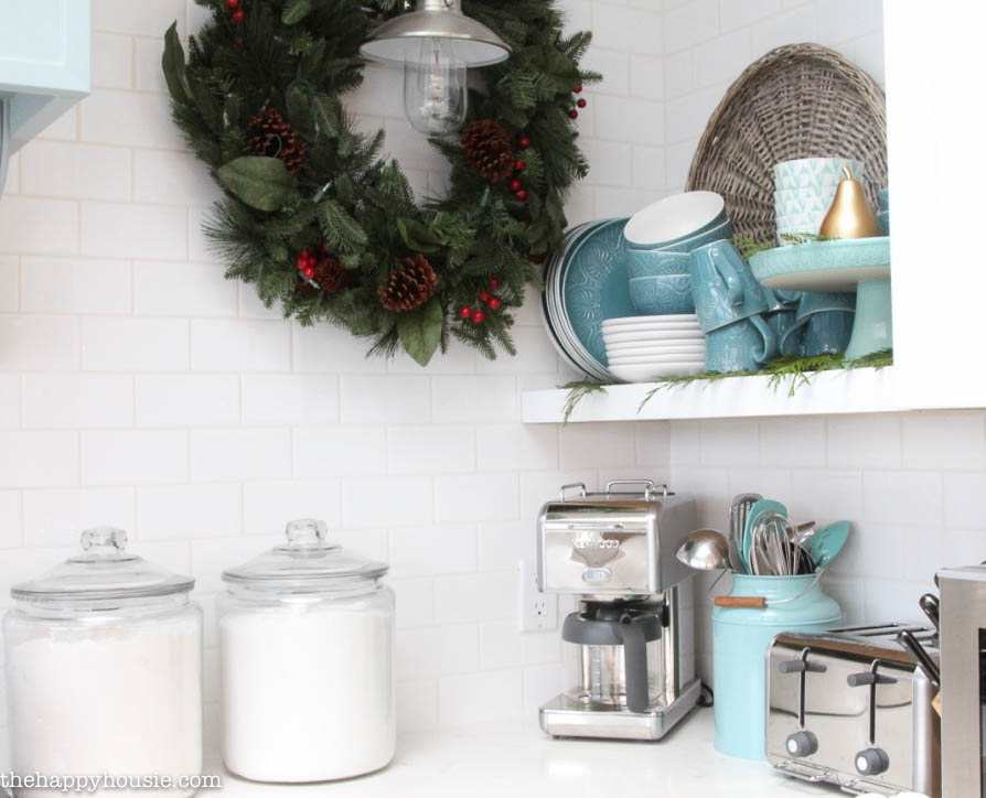 Cottage Kitchen Countertop with Large Pine Wreath and Festive Canisters — Christmas Kitchen Decor