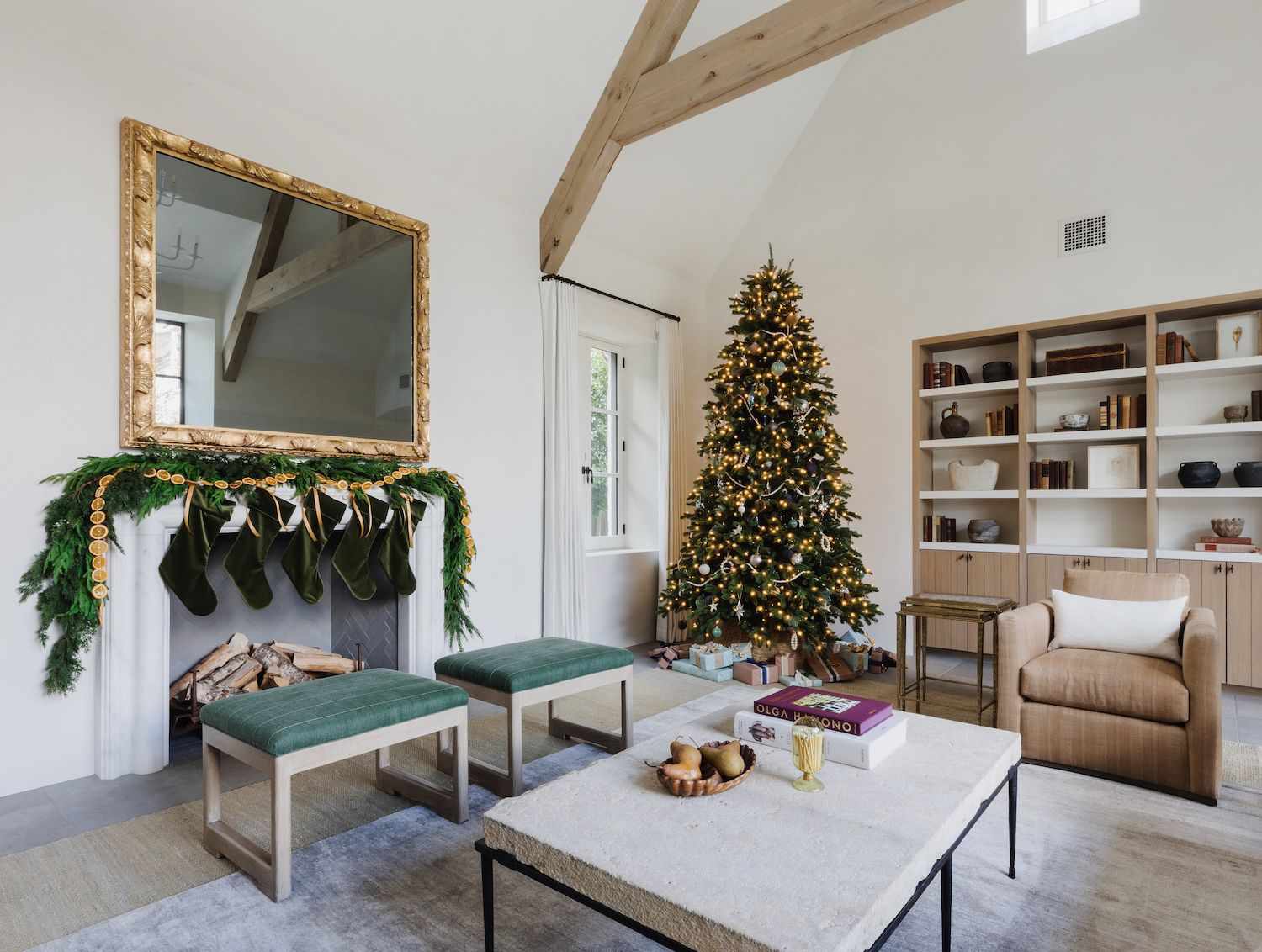 Modern Living Room with White Palette, Stone Coffee Table, and Christmas Tree — Modern Christmas Decor