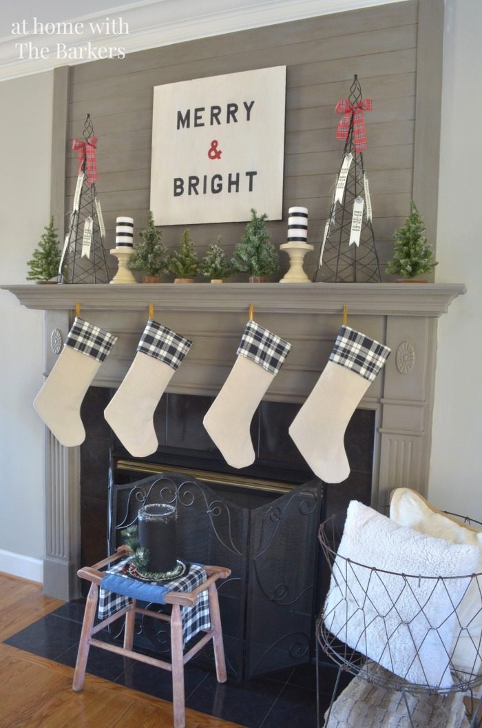 Farmhouse Plaid Stockings on Wooden Panel — Christmas Stockings Display