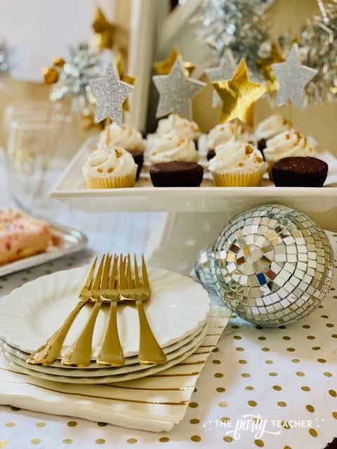 Festive Party Table with Cupcakes, Disco Ball, and Gold Cutlery — New Years Eve Party 2027