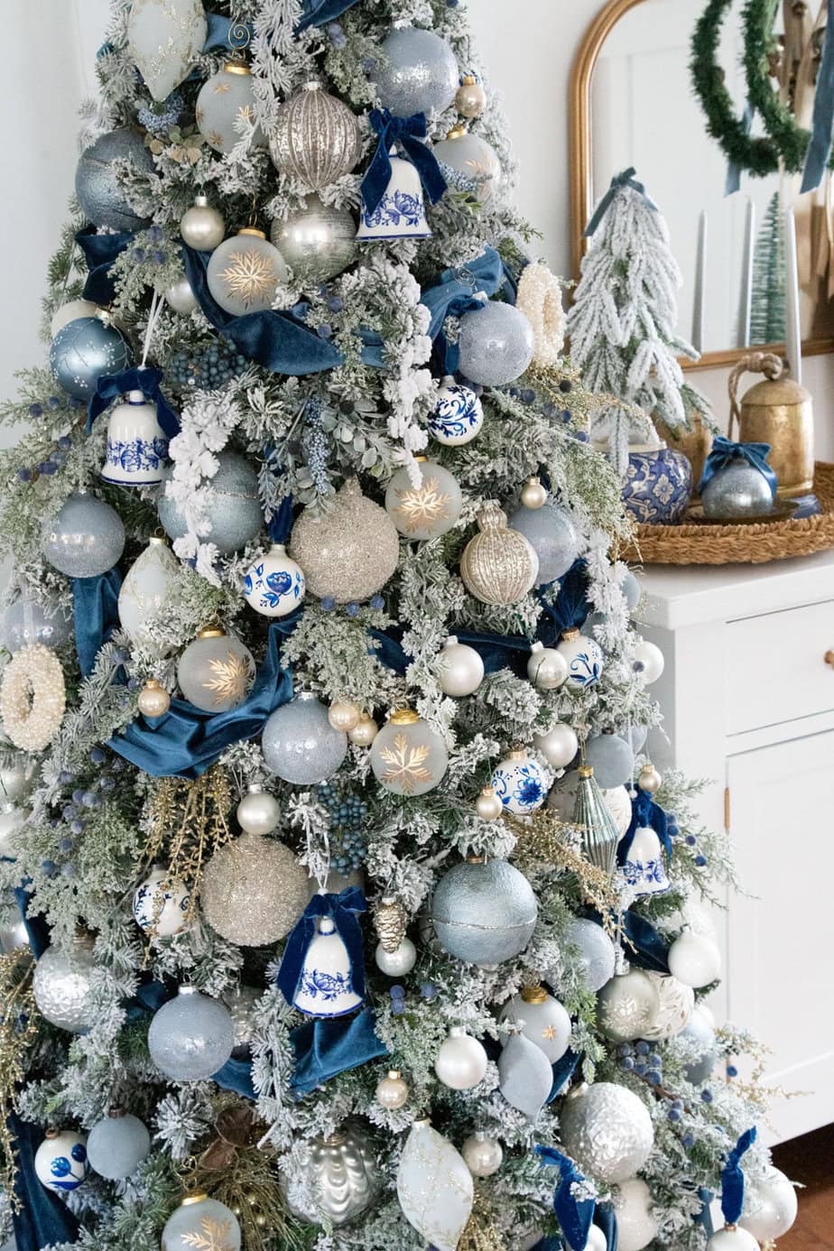 Close-Up of Flocked Tree with Blue, White, and Silver Decor — White Christmas Tree Decor