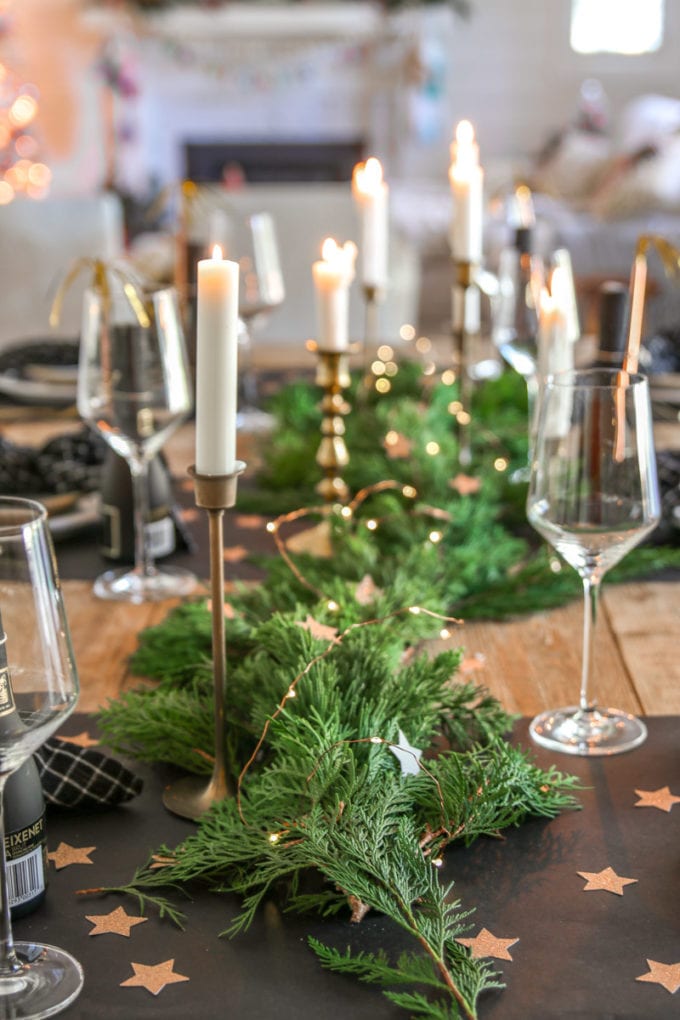 Modern Glam New Year's Eve Table with Lush Greenery and Fairy Lights Modern Glam New Year's Eve Table with Lush Greenery and Fairy Lights — New Years Eve Table Decor