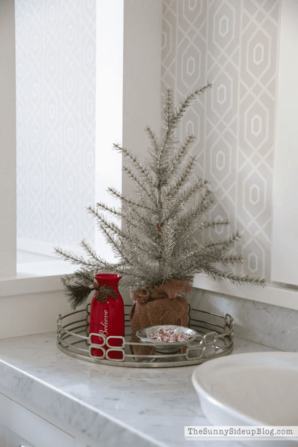 Modern Countertop Vignette with Tinsel Christmas Tree and Red Vase Modern Countertop Vignette with Tinsel Christmas Tree and Red Vase — Christmas Bathroom Decor