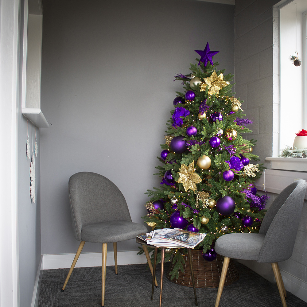 Modern Tree with Purple and Gold Ornaments in a Chic Corner — Christmas Tree Color Schemes