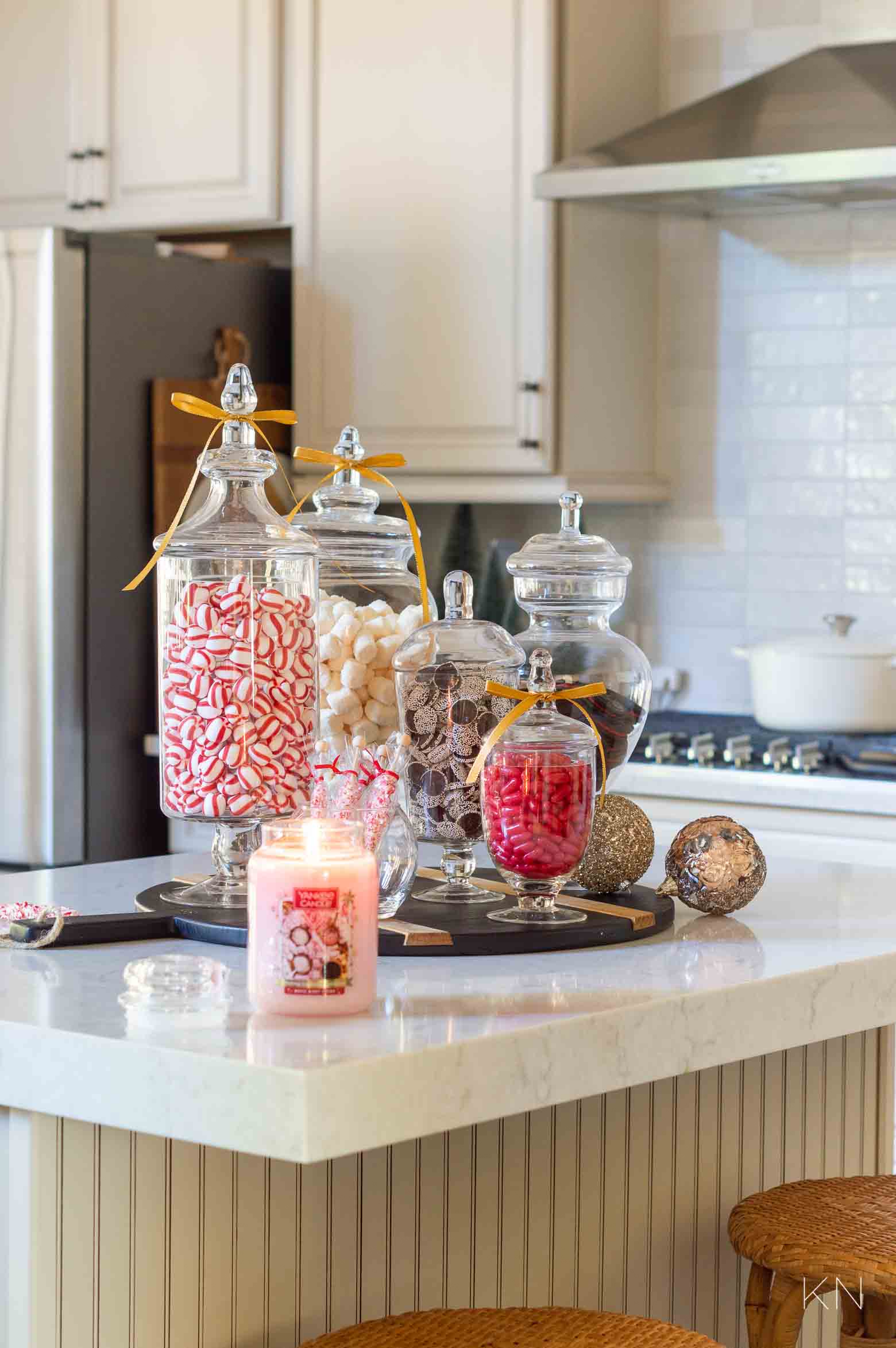 Bright Kitchen Counter with Pink Christmas Candle and Candy Jars — Christmas Candle Decor