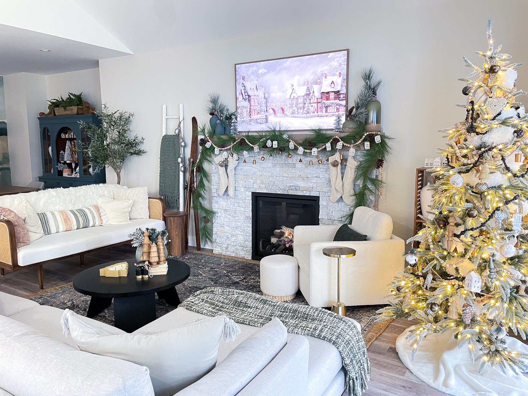 Spacious Living Room with Stone Fireplace and Neutral Christmas Decor — Modern Christmas Decor