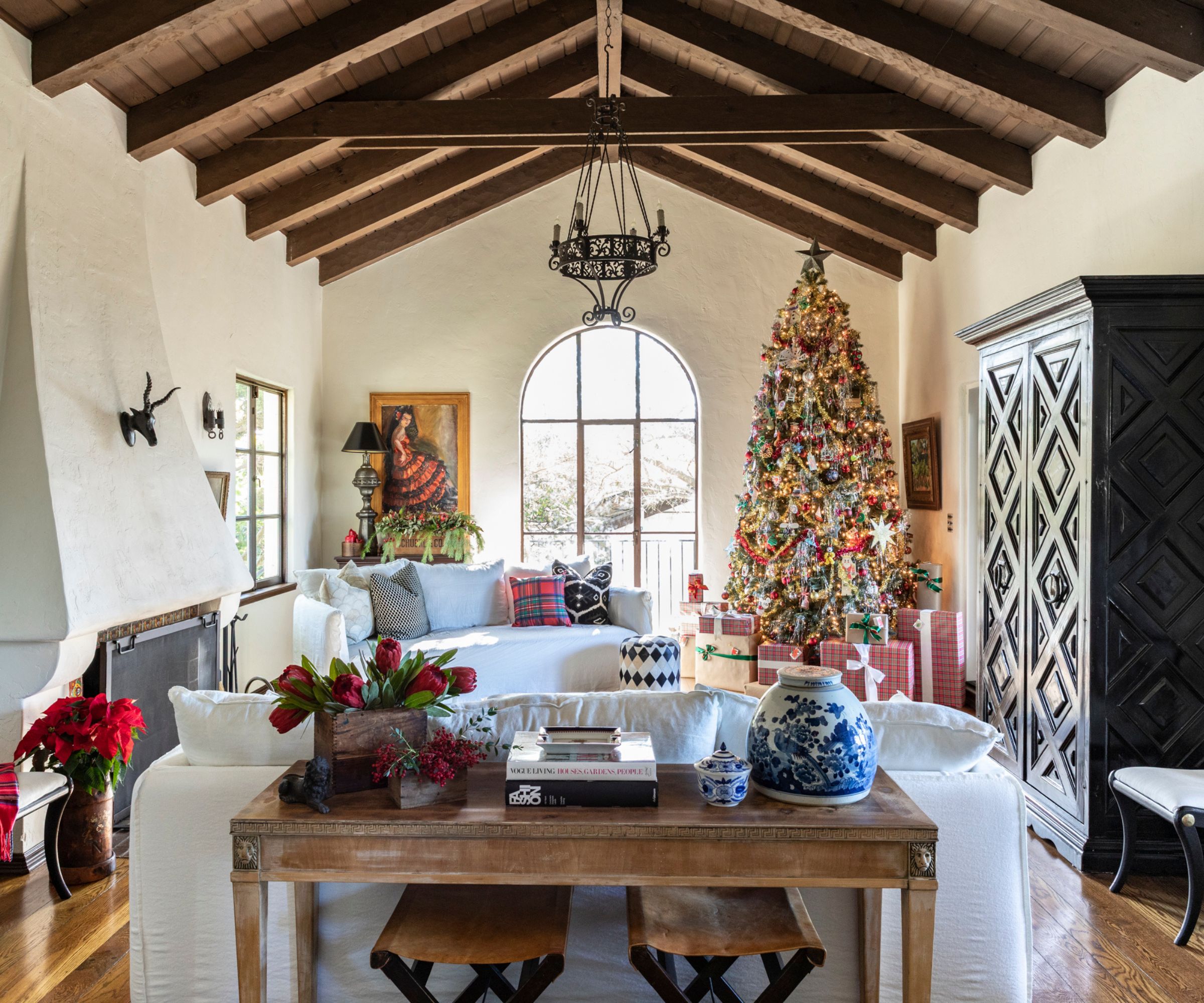 Rustic Luxury Tree with Red and Gold Accents in a Room with Beamed Ceiling — Elegant Christmas Tree