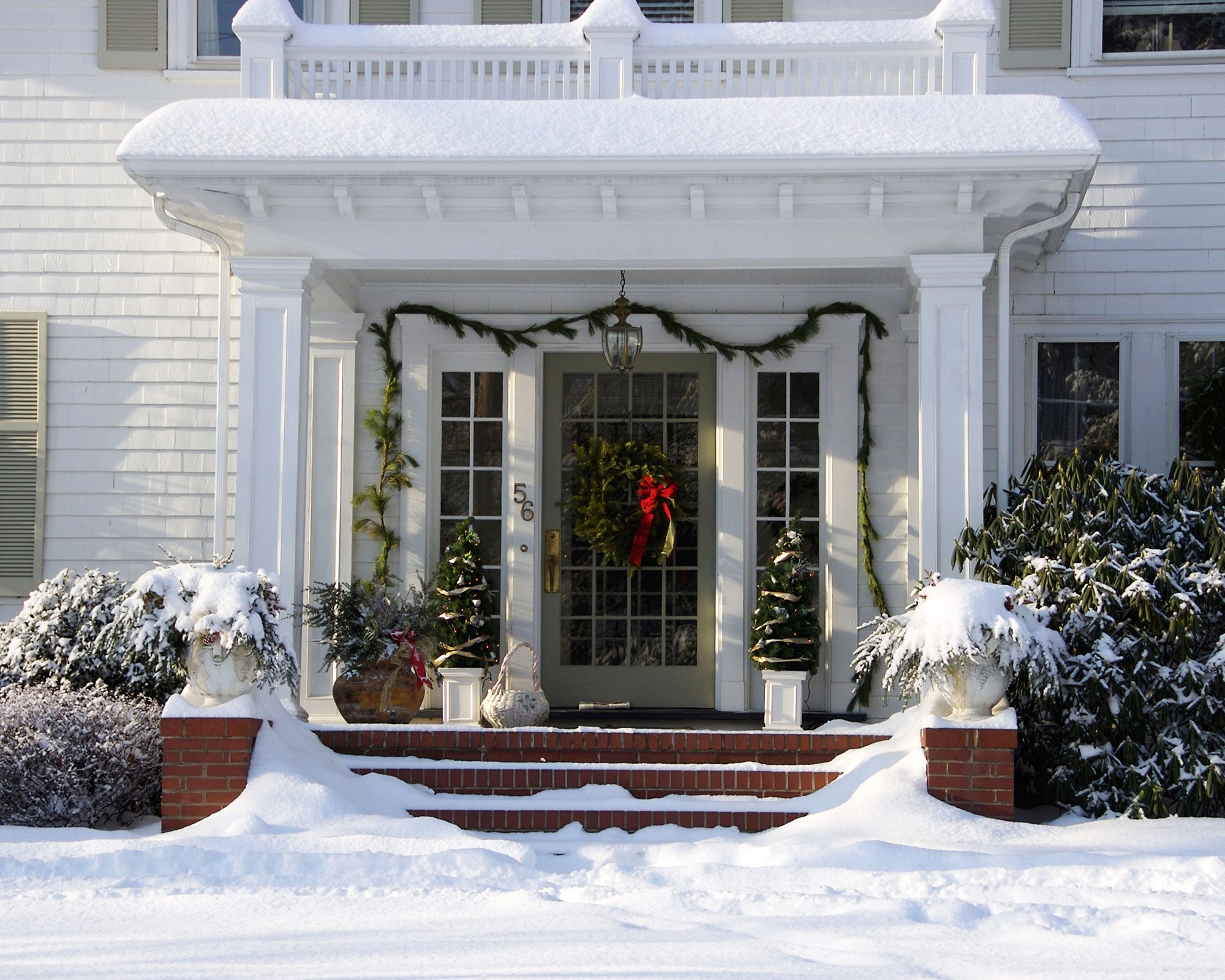 Snowy Porch with Traditional Greenery and Wreath — Christmas House Exterior Decor