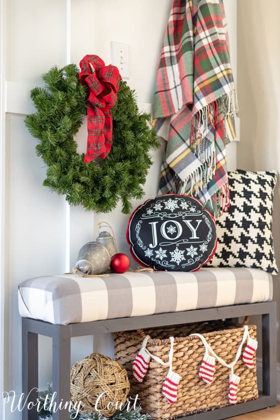 Farmhouse Entryway Bench with Plaid Wreath and Cozy Textiles Farmhouse Entryway Bench with Plaid Wreath and Cozy Textiles — Christmas Entryway Decor