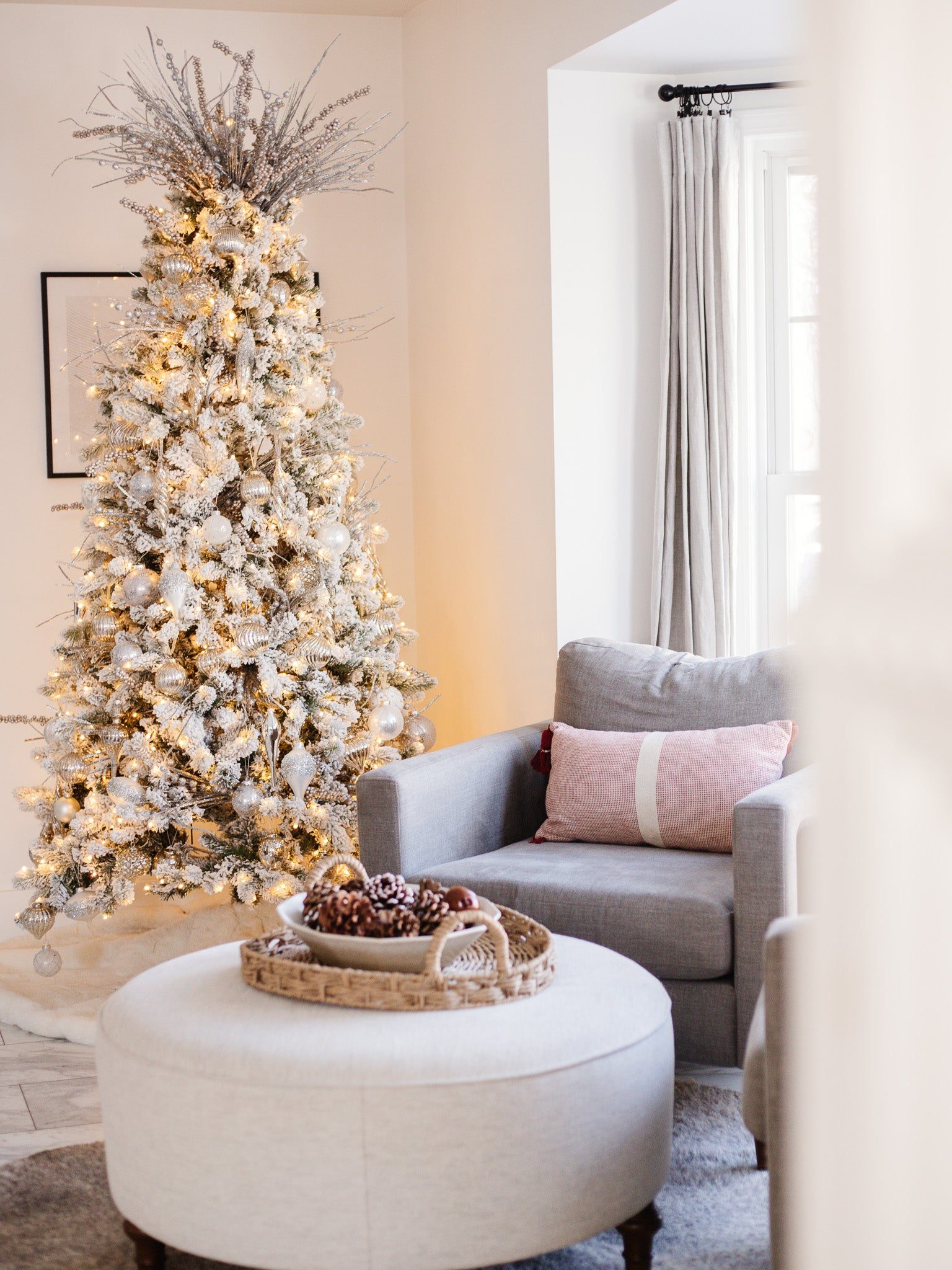 Cozy Living: Flocked Tree with Grey Armchair and Striped Pillow Cozy Living: Flocked Tree with Grey Armchair and Striped Pillow — Flocked Christmas Tree Decor