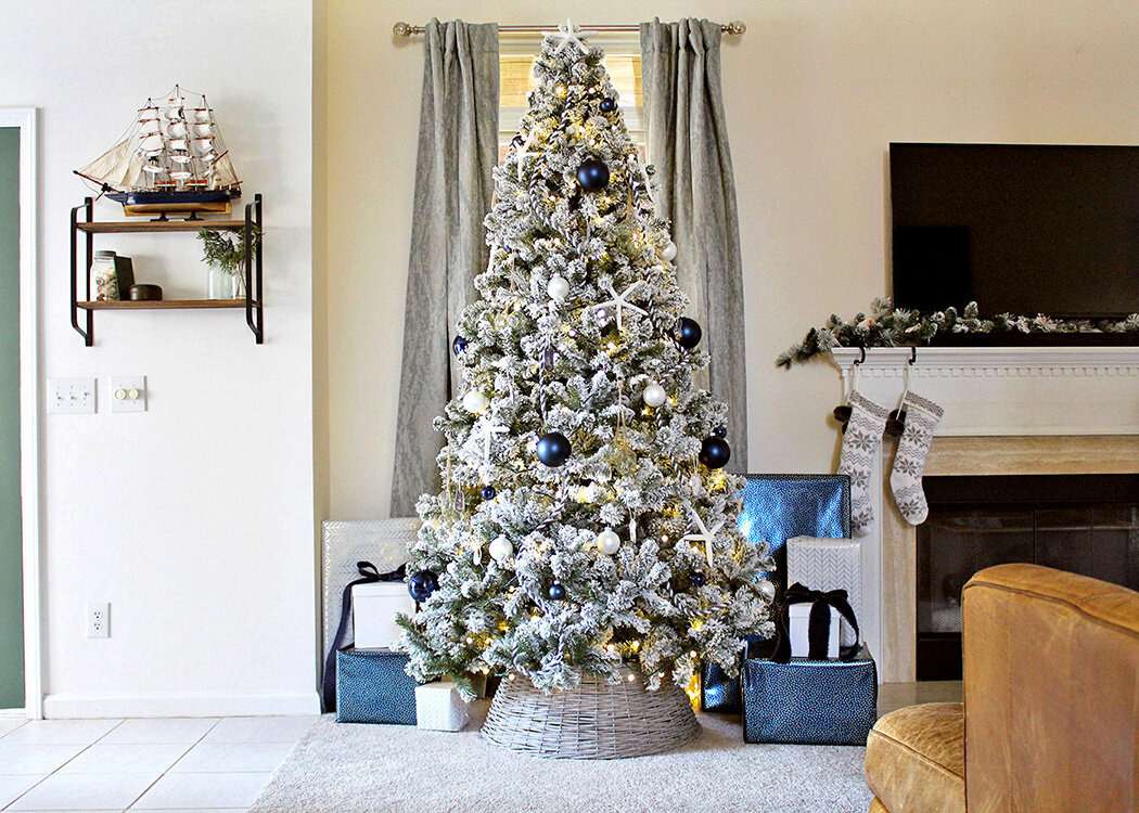 Spacious Living Room with Flocked White Tree and Blue Accents — White Christmas Tree Decor