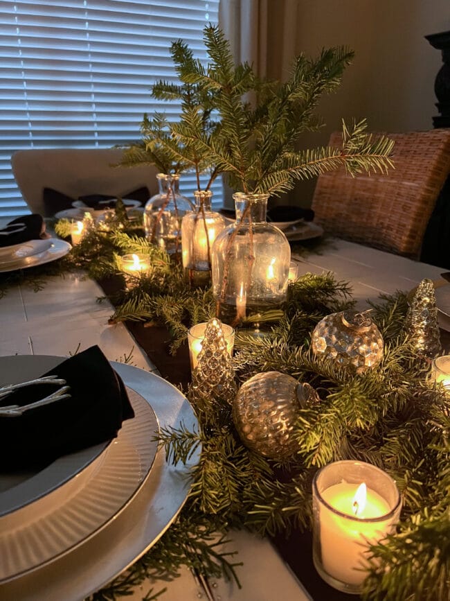Festive Tablescape with Evergreen Garland and Votive Candles — Christmas Candle Decor