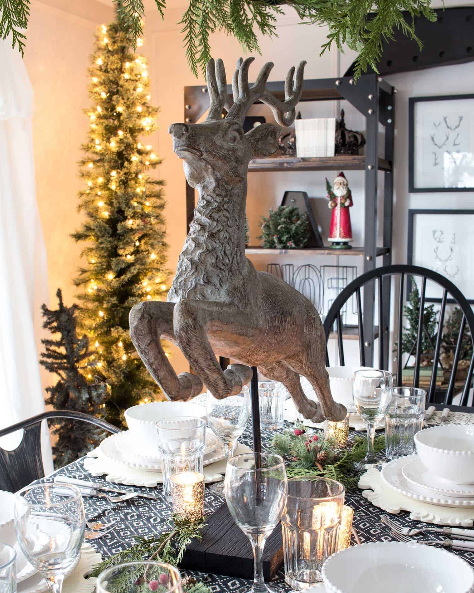 Eclectic Dining Room Featuring a Dramatic Reindeer Sculpture Centerpiece — Christmas Dining Room Decor