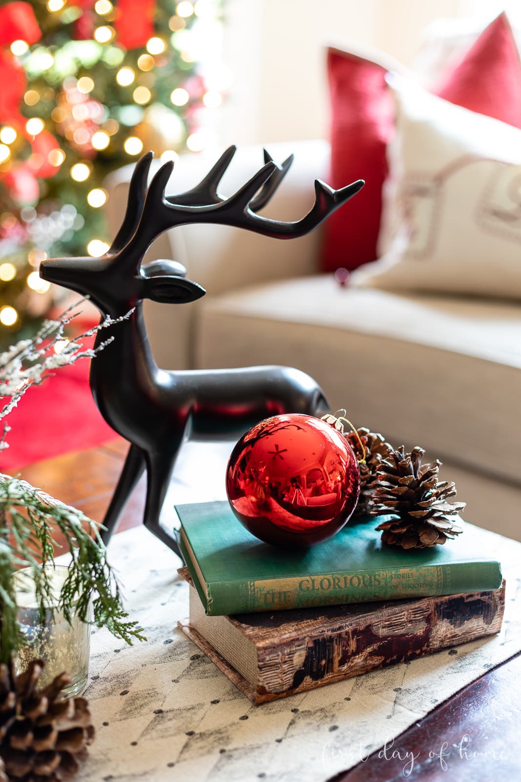 Traditional Coffee Table with Black Metal Deer and Red Ornament Traditional Coffee Table with Black Metal Deer and Red Ornament — Christmas Coffee Table Decor