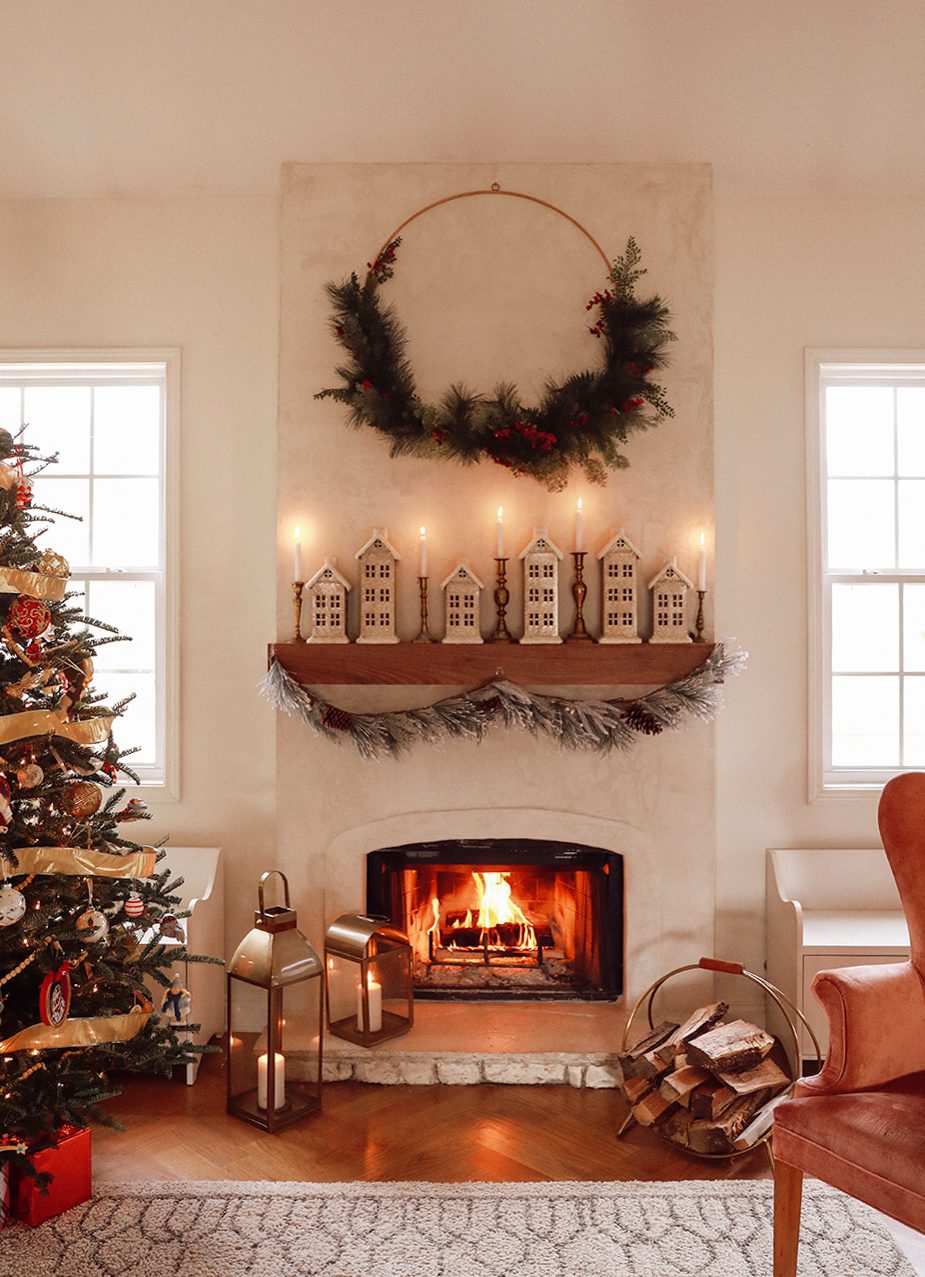 Minimalist Fireplace with Ceramic Houses, Candles, and Greenery Wreath Minimalist Fireplace with Ceramic Houses, Candles, and Greenery Wreath — Christmas Fireplace Decor