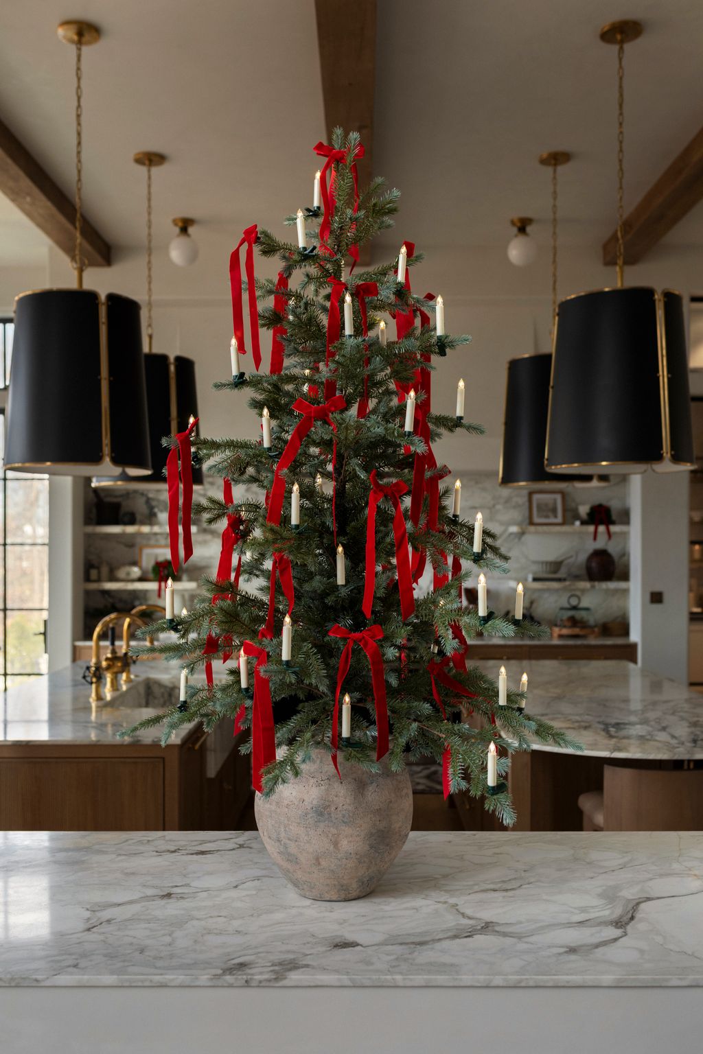 Minimalist Red Ribbon Christmas Tree on a Kitchen Island — Christmas Tree Decorating