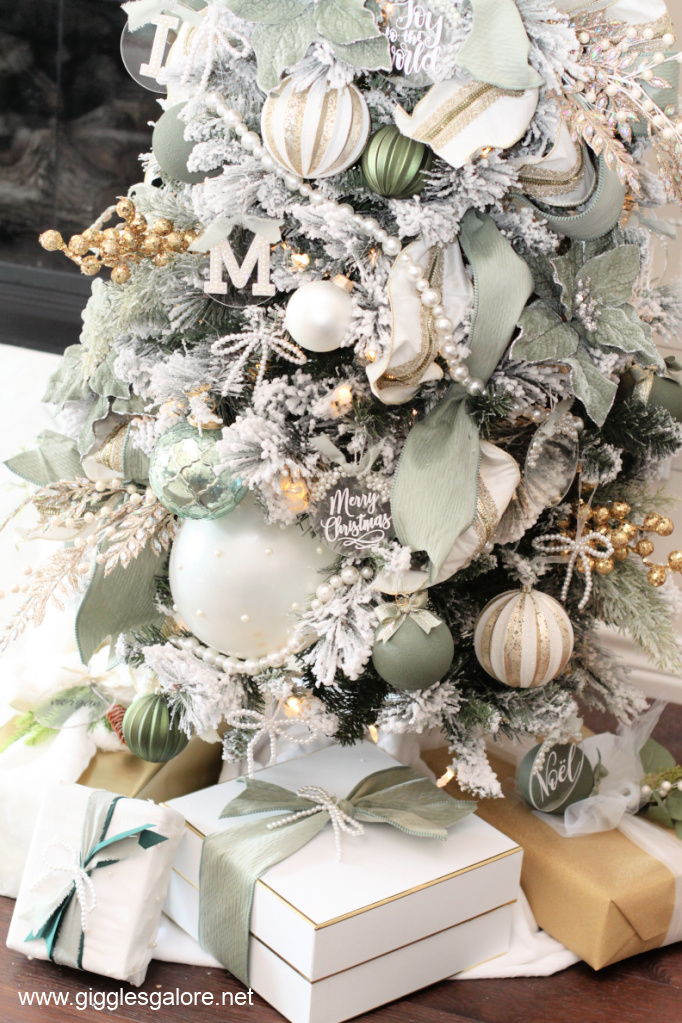 Elegant Flocked Christmas Tree with Pearl and Gold Decorations Elegant Flocked Christmas Tree with Pearl and Gold Decorations — Sage Green Christmas Decor