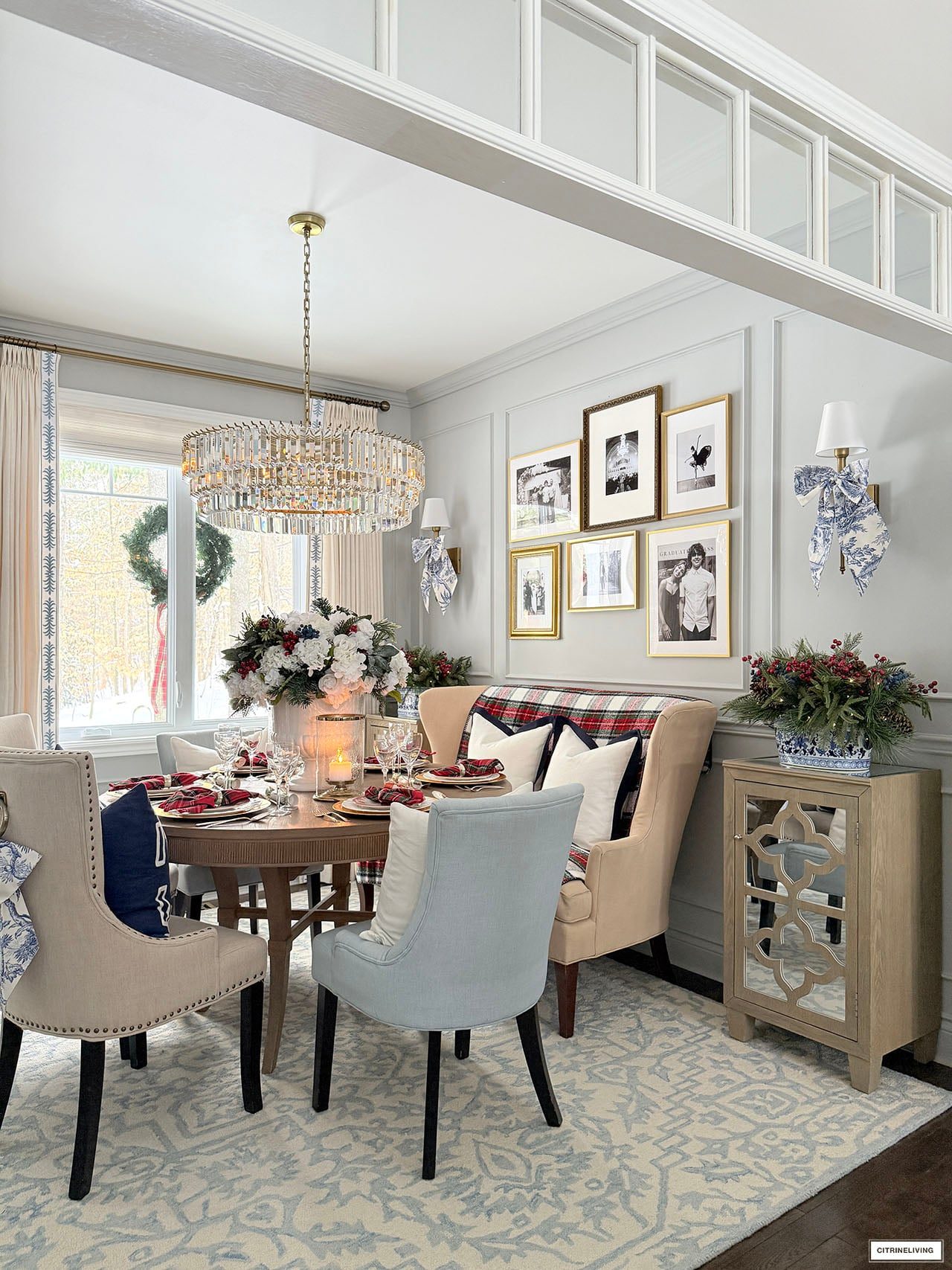 Traditional Round Dining Table with Plaid Accents and Crystal Chandelier — Christmas Dining Room Decor