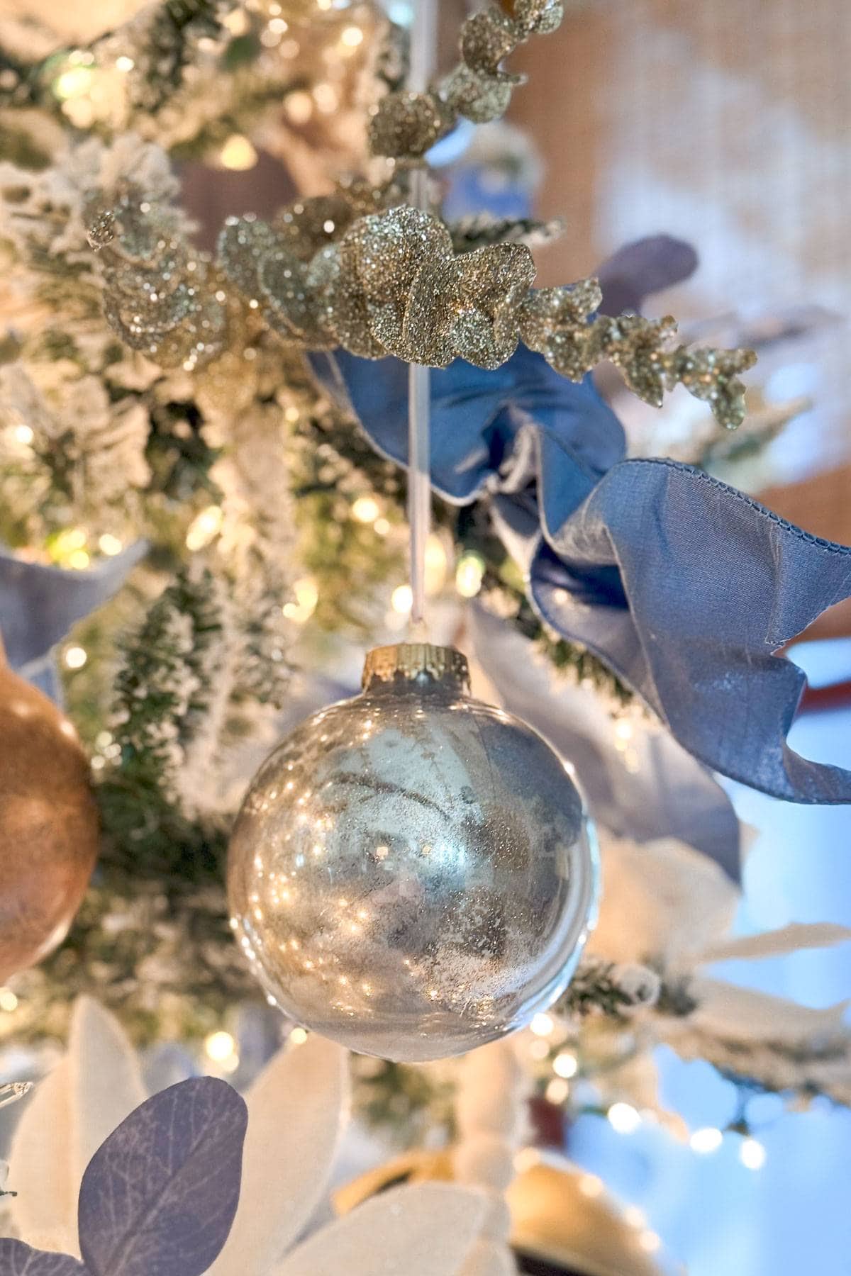 Close-Up of a Traditional Glass Christmas Ornament with Blue Ribbon — Traditional Christmas Decor
