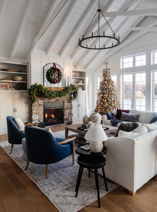 Open-Plan Living Area with Blue Accents and Stone Fireplace Open-Plan Living Area with Blue Accents and Stone Fireplace — Blue Christmas Decor